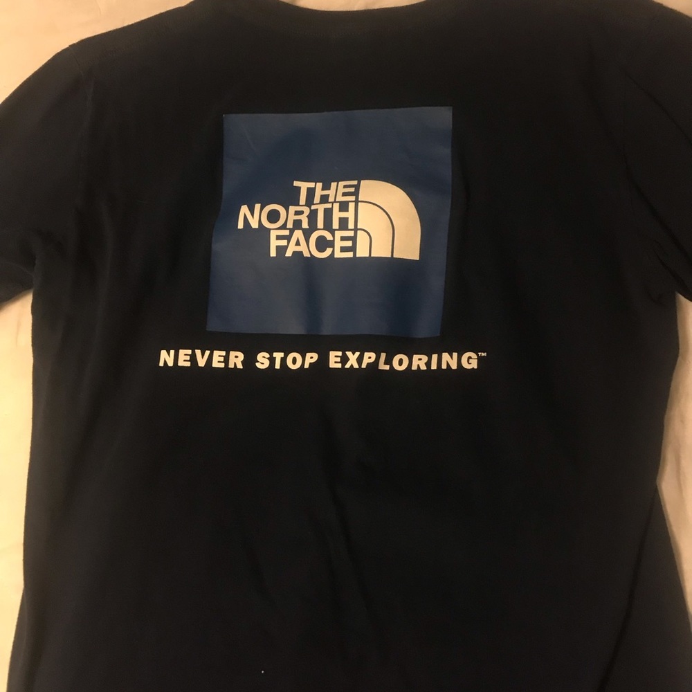 The North Face navy blue logo design